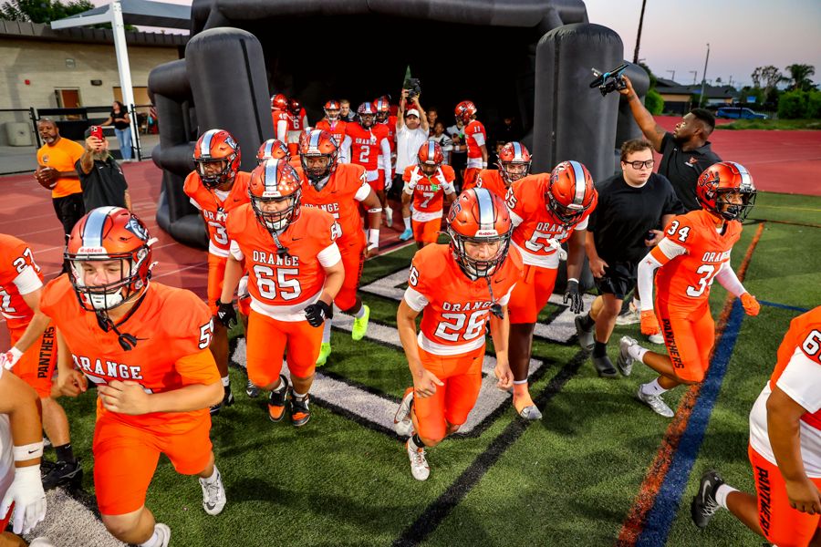 Orange Panthers taking the field through the tunnel