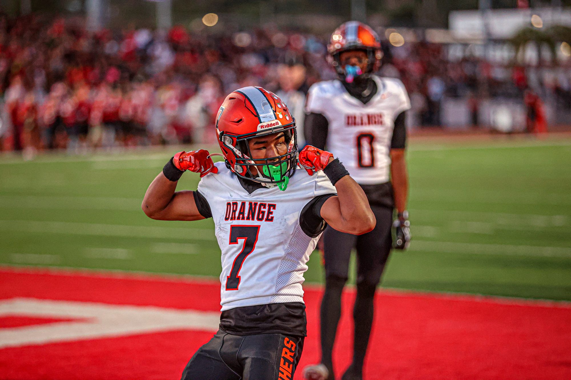Orange Panthers #7 flexing after the play