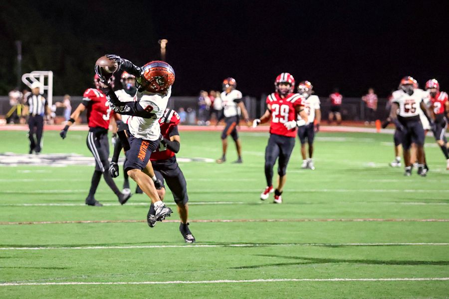 Orange Panthers defender wrapping up the ball carrier