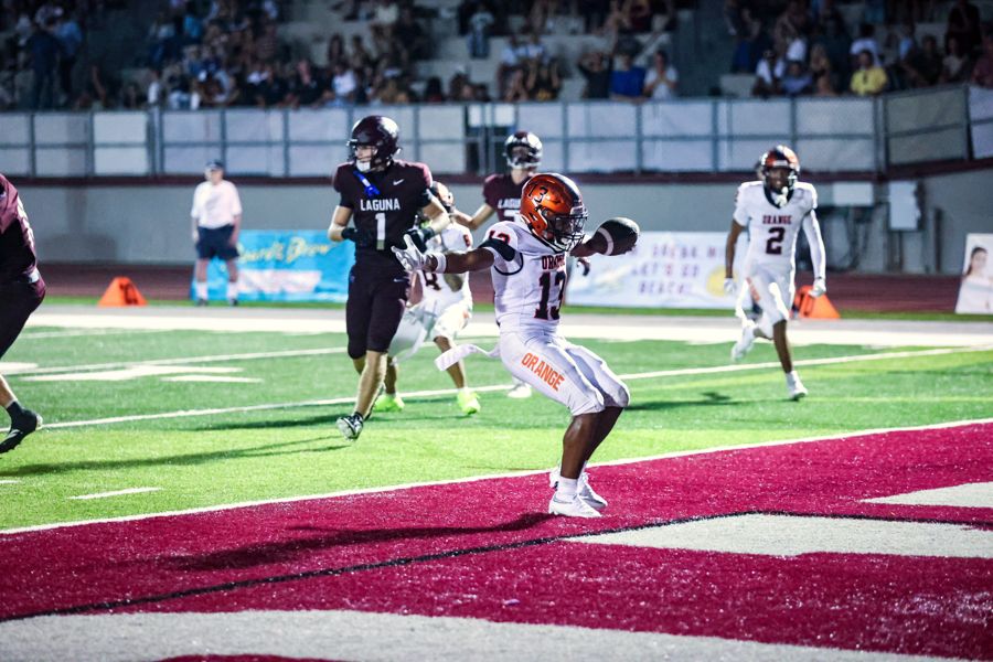 Orange Panthers running back into the end zone