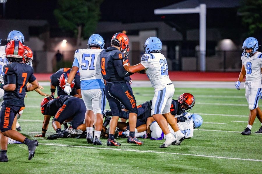Orange Panthers defense swarming the ball carrier
