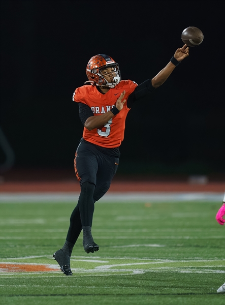 Orange Panthers quarterback under the lights